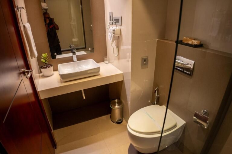 Bathroom of Deluxe room in Luxo Hotel Wayanad