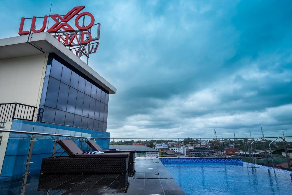 Rooftop infinity swimming pool at Luxo Wayanad
